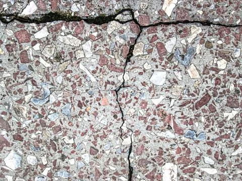 Crack on the granite surface. Broken granite texture. Stock Photos