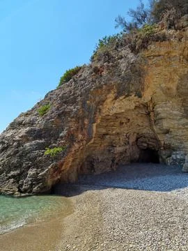 A crack into Hell in the rock in Greece Stock Photos