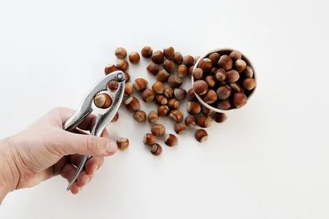 Crack the nut. Nutcracker. Nuts in the bowl. Stock Photos