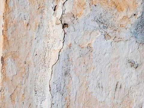 Crack on an old roughly painted wall Stock Photos