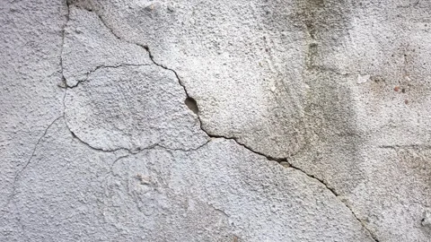 Crack in plastered wall. Cracked plaster, animation. Stock Footage 288344033