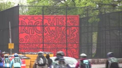 CRACK IS WACK SIGN AS CYCLISTS GO BY Video stock 51060894