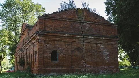 A crack in the wall of a brick building. The stable. 19th century buildings Stock Photos