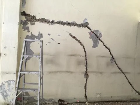 Crack wall in building before repair Stock Photos