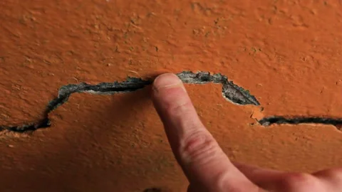 Crack in the wall close-up. Cracked wall plaster and paint. Stock Footage 173326549