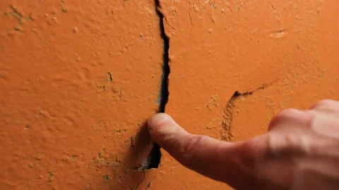 Crack in the wall close-up. Cracked wall plaster and paint. Stock Footage 173326606