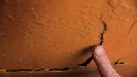 Crack in the wall close-up. Cracked wall plaster and paint. Stock Footage 173326611