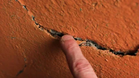 Crack in the wall close-up. Cracked wall plaster and paint. Stock Footage 173326612