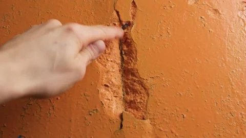 Crack in the wall close-up. Cracked wall plaster and paint. Stock Footage 173326620