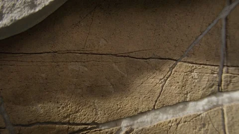 Cracked and Weathered Rock Surface with Natural Patterns Stock Footage 289517681