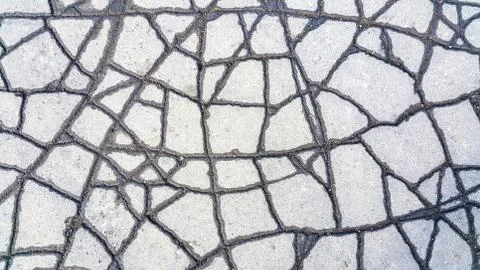 Cracked asphalt after rain Stock Photos