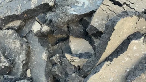 Cracked asphalt surface with rough texture, forming abstract pattern ideal .. Stock Footage 340194352