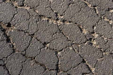 Cracked asphalt texture. Top view. Asphalt. Road background Stock Photos