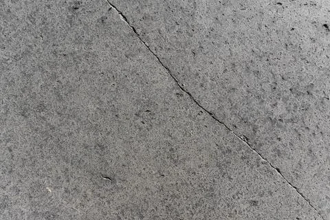 Cracked basalt stone texture background, grey volcanic lava paving slabs Stock Photos