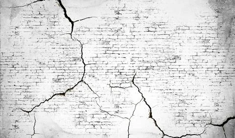 Cracked brick texture in black and white with intersecting lines resembling.. Illustrazione stock