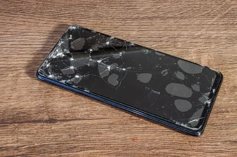 Cracked, broken screen on smartphone Stock Photos