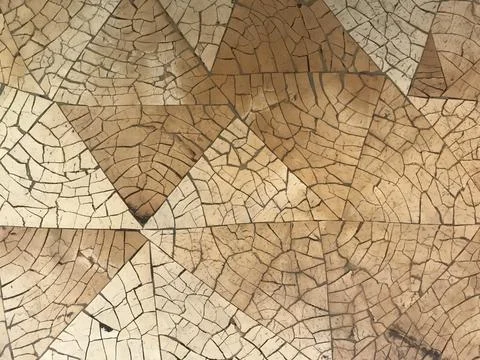 Cracked brown tiles surface in a triangle shape Stock Photos