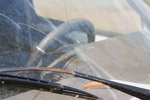 Cracked Car Windshield with Spiderweb Damage Close-up Stock Photos