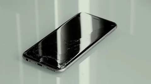 Cracked cellphone Video stock 104017314
