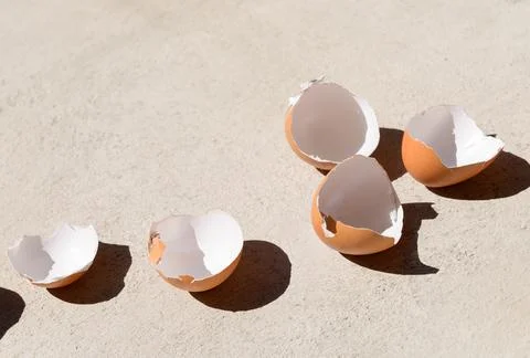 Cracked chicken egg shells background Stock Photos