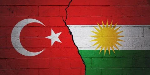 Cracked cinder block wall painted with a Turkish flag and a Kurdish flag Illustrazione stock
