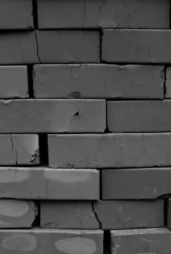 Cracked Clay Bricks in a Pile Grayscale Vertical Image Stock Photos