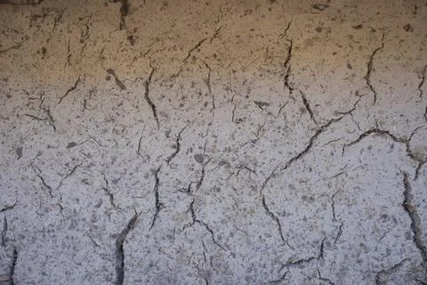 Cracked Clay Wall Texture Background With Natural Earth Pattern Stock Photos