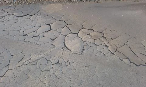 Cracked coal mining waste surface texture. Stock Photos