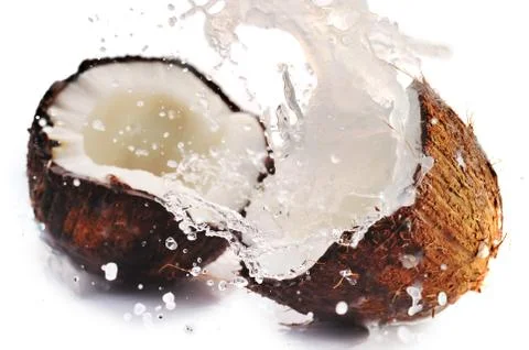 Cracked coconut with splash Foto stock