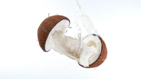 Cracked coconut with splashing milk Stock Video Pond5