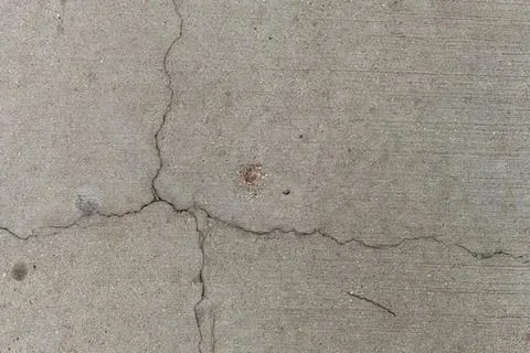 Cracked concrete floor surface with rough texture Stock Photos