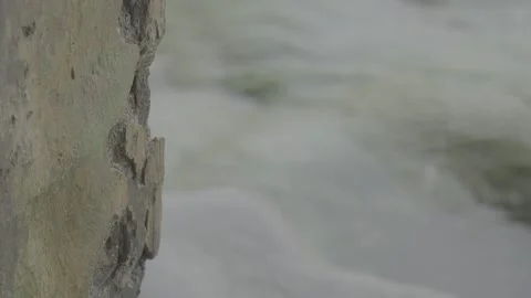 Cracked Concrete Structure with Ocean Waves in the Background S-Log3 Stock Footage 313093419