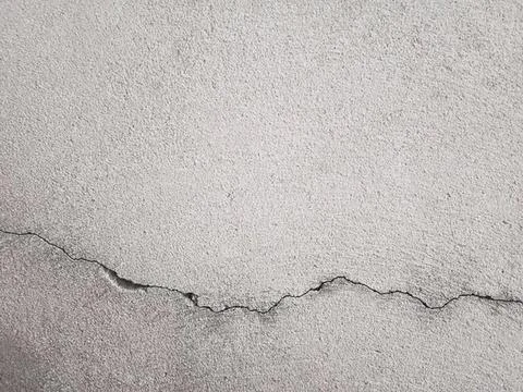 Cracked concrete wall with rough texture and lines Stock Photos