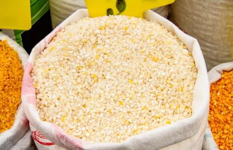 Cracked corn kernels in a sack Stock Photos