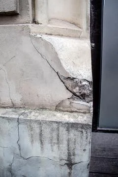 Cracked corner of the house , problems of the building structures and Stock Photos