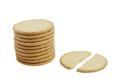 Cracked cracker next to stack of round whole bread crackers isolated on white ba Stock Photos