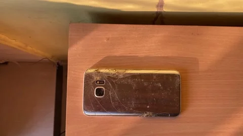 A cracked damaged surface of a phone Stock Footage 228048899