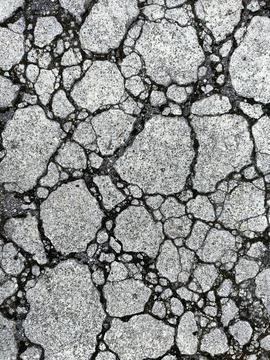 Cracked dark gray wall background Stock Photos
