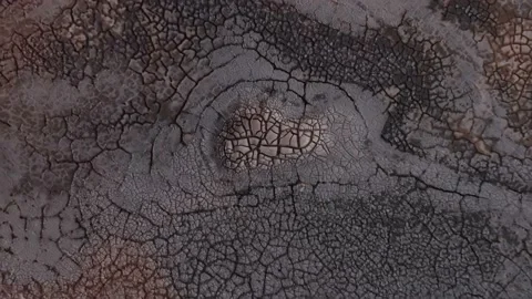 Cracked dark soil on earth surface caused by global warming, aerial Stock Footage 145569241