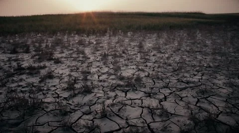 Cracked earth and the sun rises early in the morning Stock Footage 53545029