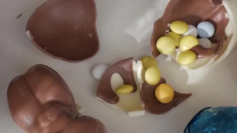 Cracked Easter Chocolates Revealing Colorful Treats Inside Stock Footage 332944220