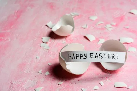 Cracked egg on pink background Stock Photos