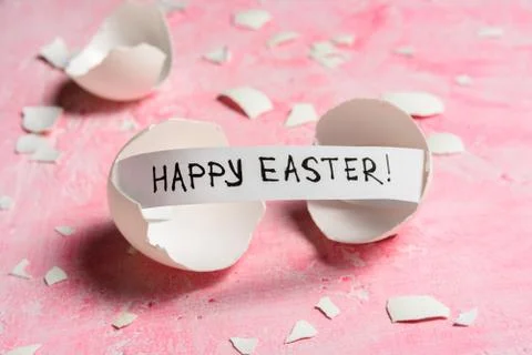 Cracked egg on pink background Stock Photos