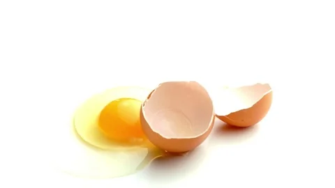 Cracked egg with shell isolated on white in studio Stock Footage 75979804