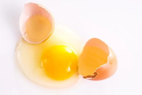 Cracked Egg with Shell Isolated on white Stock Photos