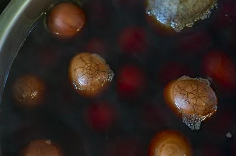 Cracked Eggs In Dark Tea Bath Stock Photos