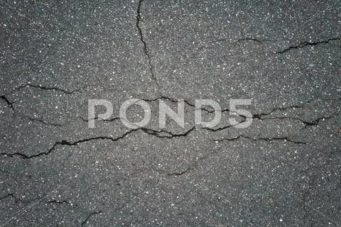 Cracked gray asphalt background Stock Photos