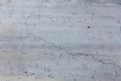 Cracked gray concrete wall surface with texture and lines Stock Photos
