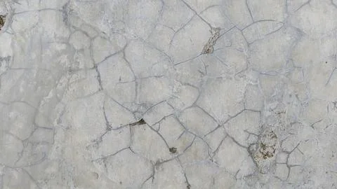 Cracked grey concrete texture background with weathered cement surface pattern Stock Photos