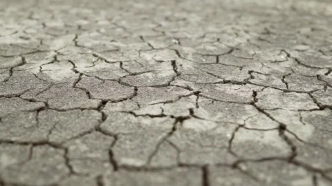 Cracked ground after drought soil soil crust earth climate change environmental Vídeo Stock 334030292